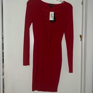 Never worn long sleeve red sweater dress with criss cross design.